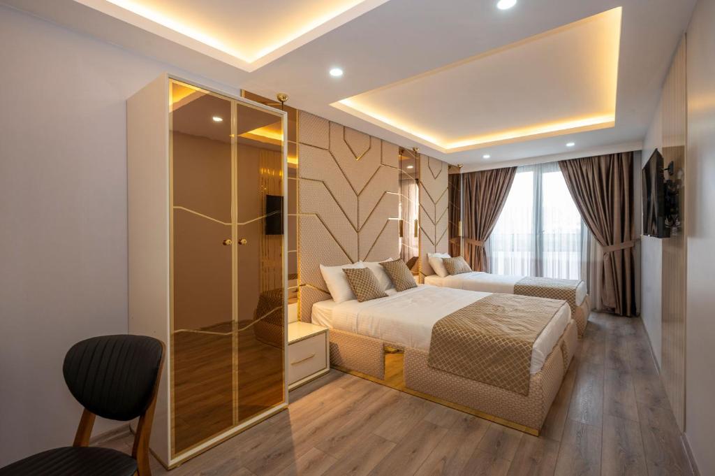 A bed or beds in a room at Luxury Airport Hotel