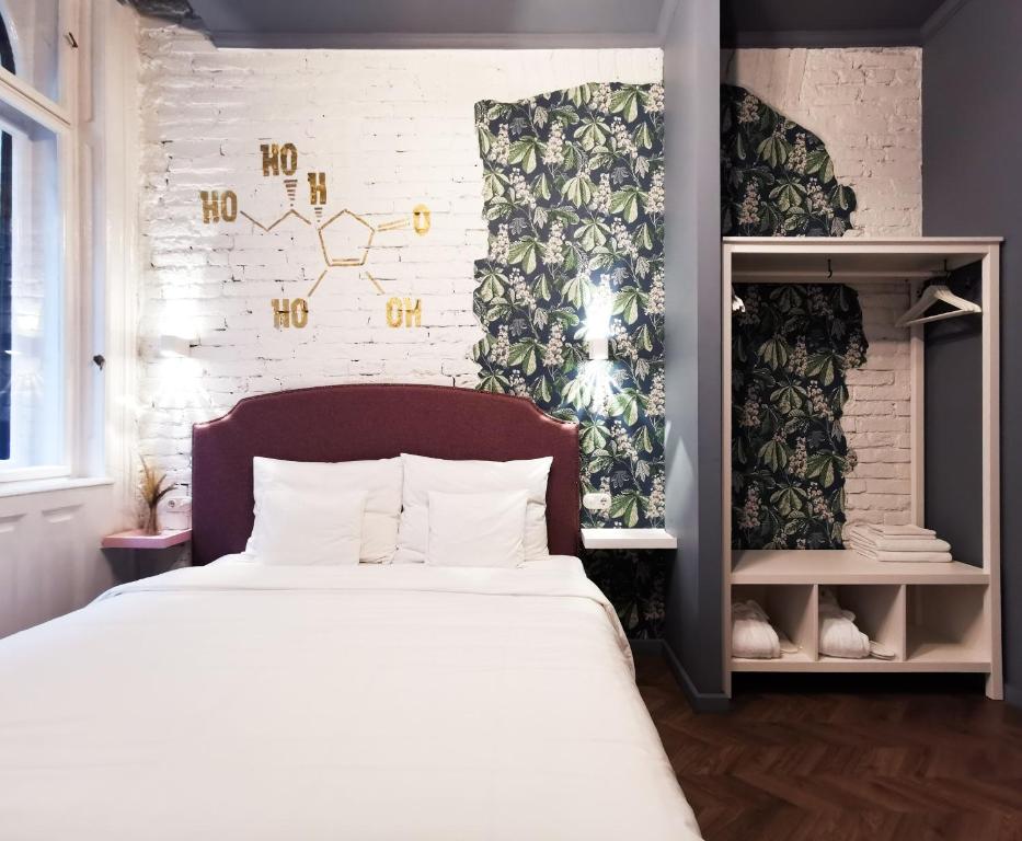 Postel nebo postele na pokoji v ubytování Metropolis Budapest Boutique Hotel