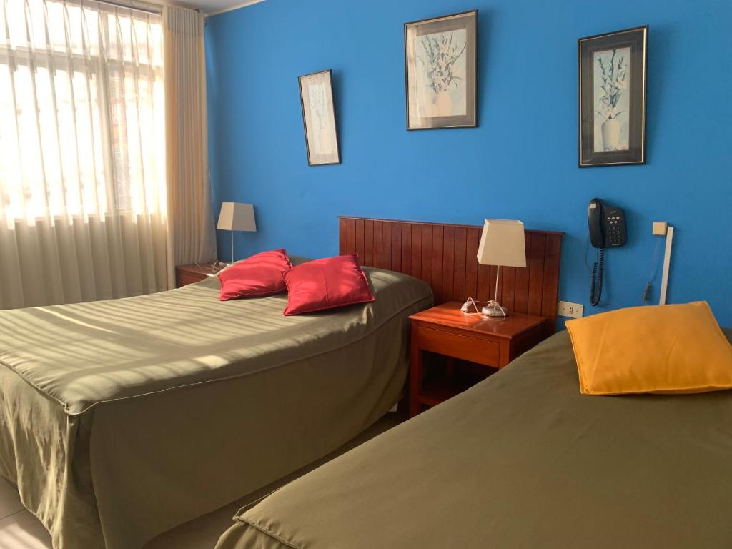 A bed or beds in a room at Hotel Acuario