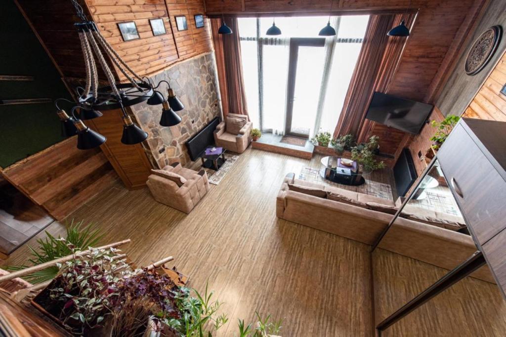 an overhead view of a living room with a couch at Evdo Apartments Loft2 Wooden House in Gudauri