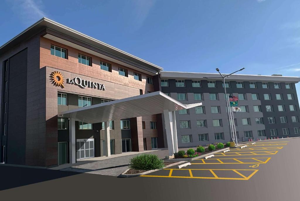 a rendering of the front of a hotel at La Quinta by Wyndham Chicago O'Hare Airport in Rosemont