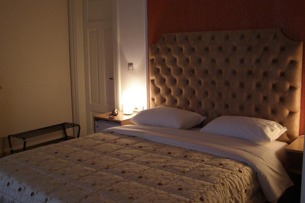 A bed or beds in a room at Room in Faneromeni's grove