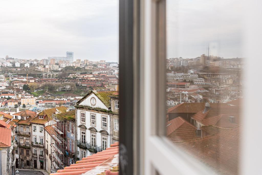 a view of a city from a window at Door 65 - Historical Center Apartments in Porto