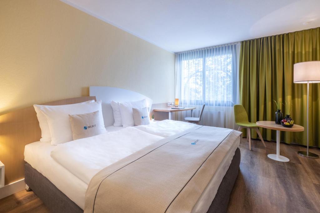 Krevet ili kreveti u jedinici u okviru objekta Select Hotel Erlangen