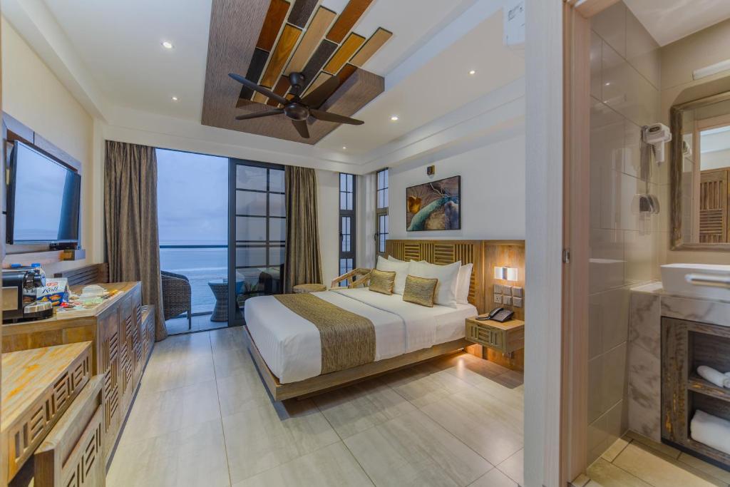 Tempat tidur dalam kamar di Hotel Ocean Grand at Hulhumale