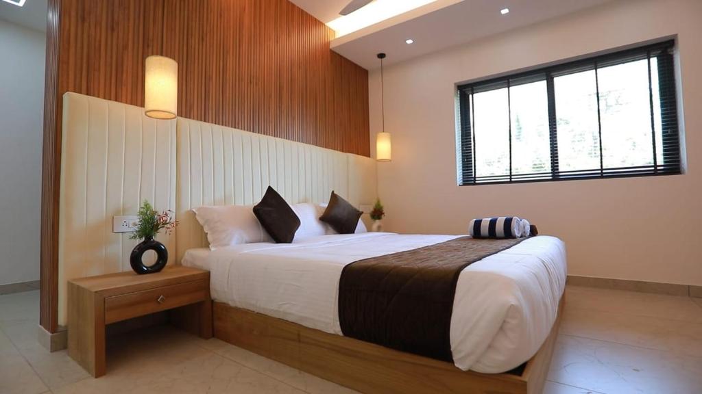 Cama ou camas em um quarto em Alleppey Haven Beach Villa