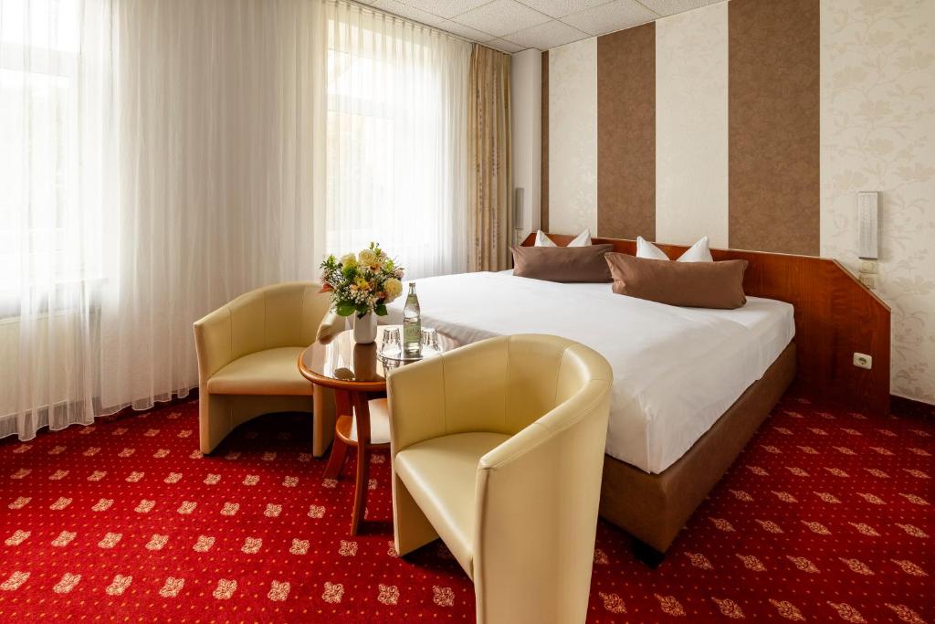 Giường trong phòng chung tại Hotel Berlin