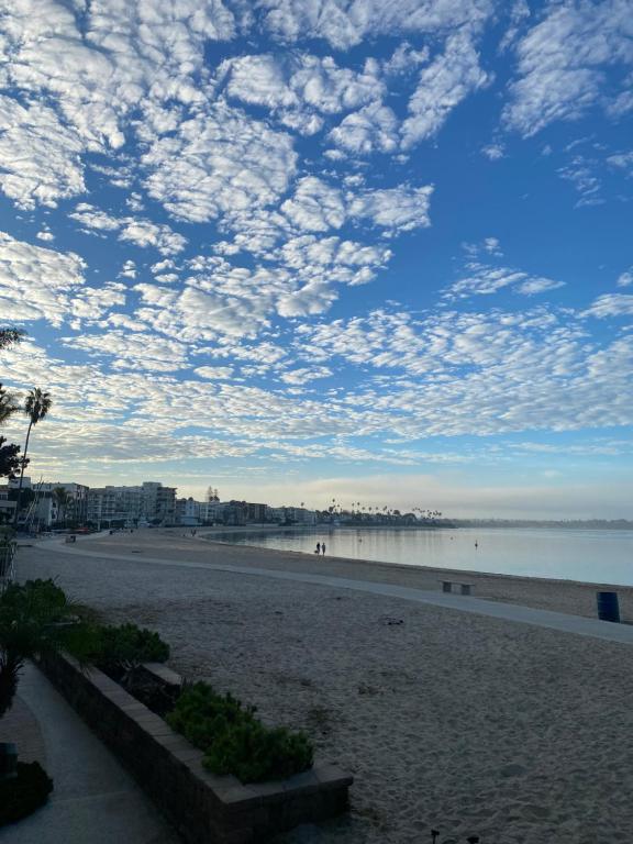 a view of a beach with a cloudy sky at Bay Beach Bungalow in San Diego