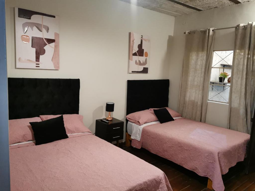 Hermoso departamento en el centro ciudad, casa M MELGAR tesisinde bir odada yatak veya yataklar