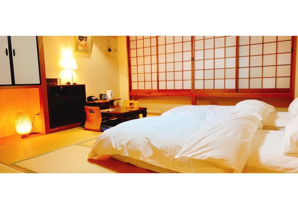 Krevet ili kreveti u jedinici u okviru objekta Nara Ryokan - Vacation STAY 49570v