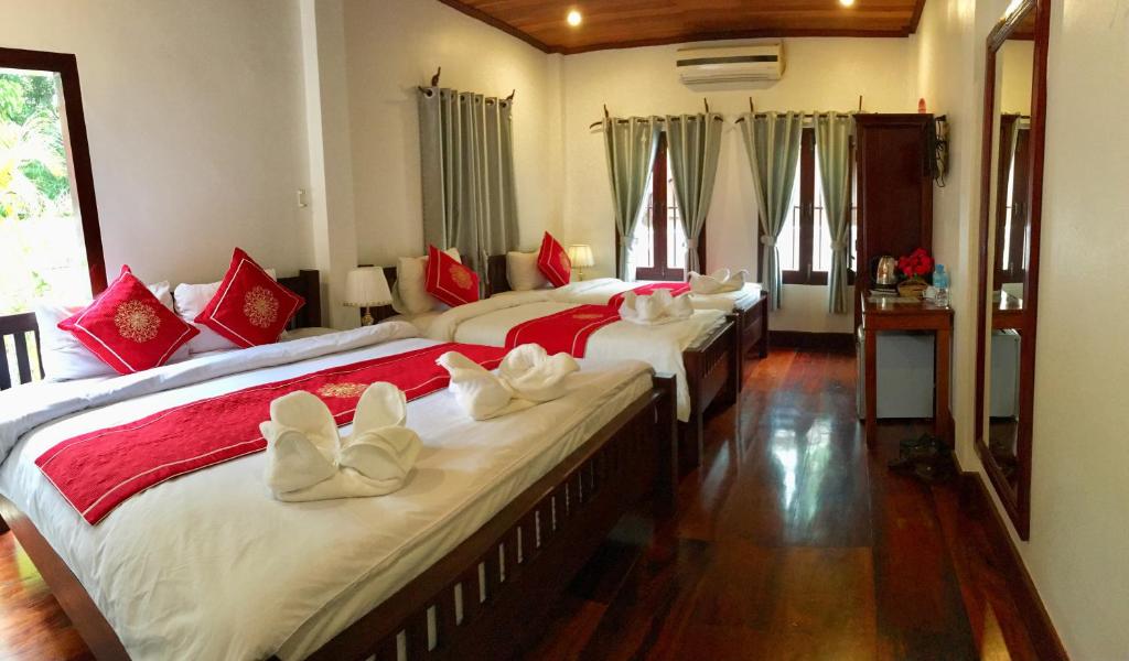 Luang Prabang Pangkham Lodge में एक कमरे में एक या कई बेड