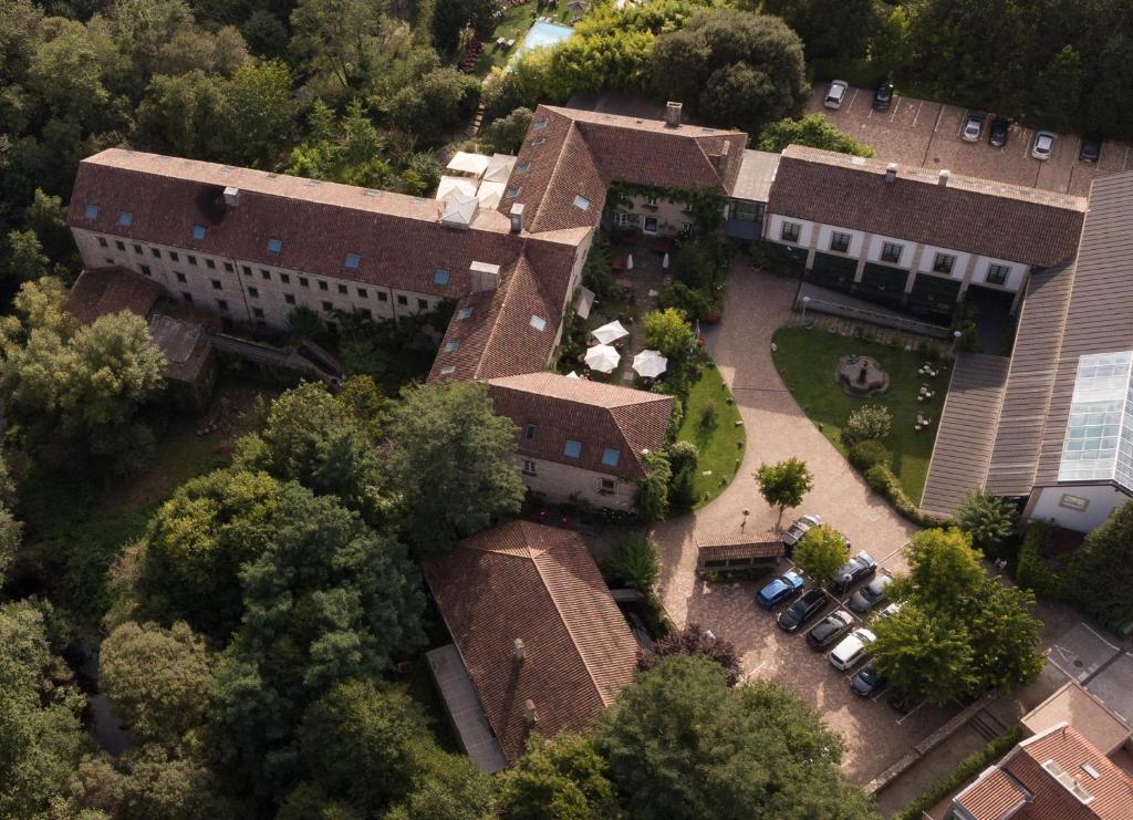 an aerial view of a building with a yard at A Quinta Da Auga Hotel Spa Relais & Chateaux in Santiago de Compostela