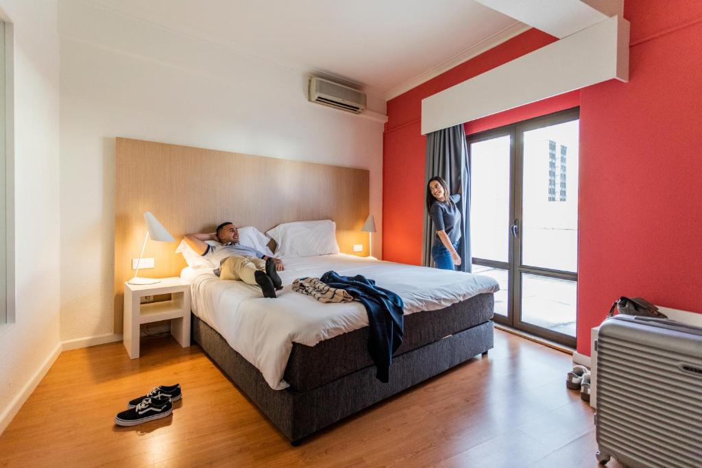 Ένα ή περισσότερα κρεβάτια σε δωμάτιο στο Stay Hotel Coimbra Centro