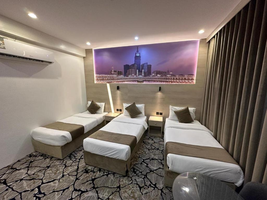 Кровать или кровати в номере فندق اسكنت الحفاير - Askant Al Hafayer Hotel