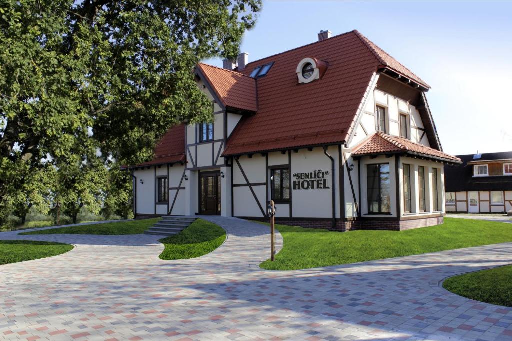 a rendering of a house with a driveway at Hotel Senlīči in Jelgava