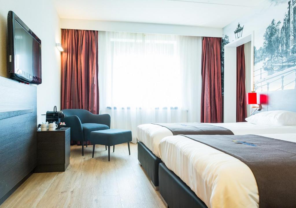 Postel nebo postele na pokoji v ubytování Bastion Hotel Amsterdam Amstel