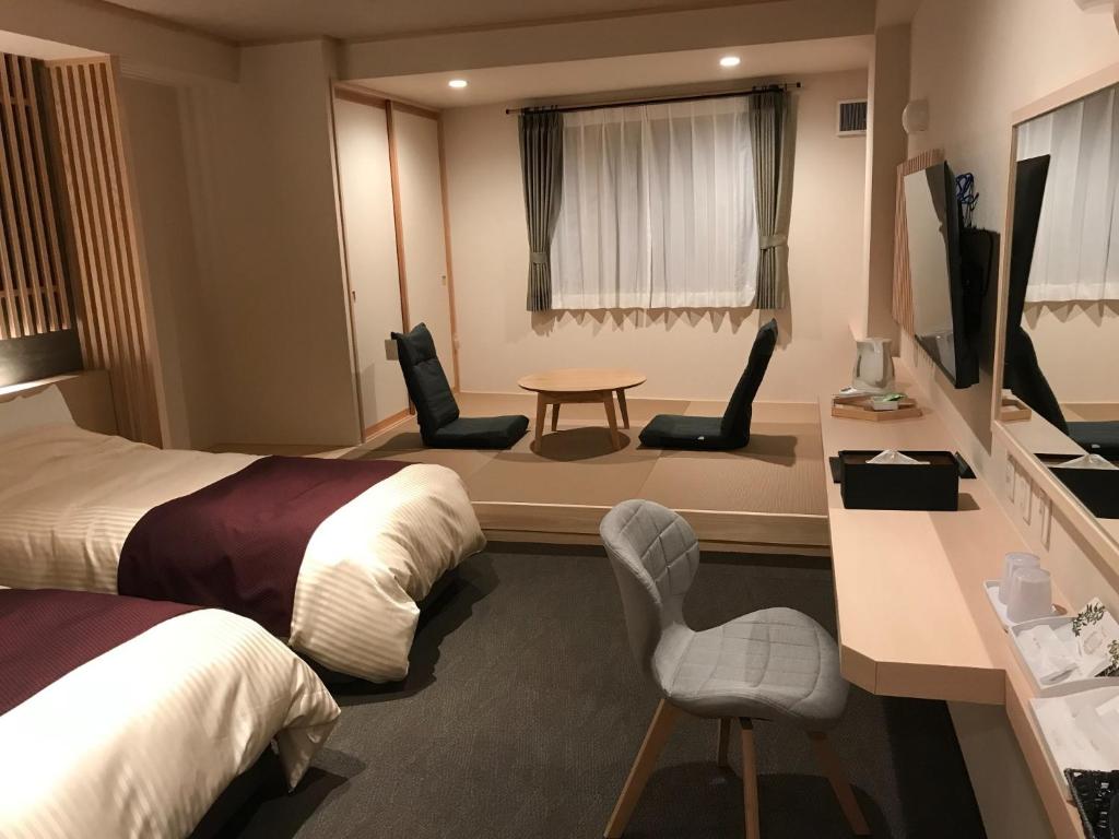 Кровать или кровати в номере Aizu Tsuruya Hotel - Vacation STAY 57204v