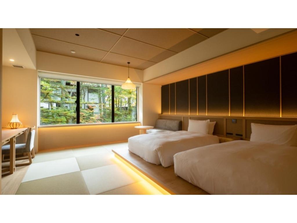 Cama ou camas em um quarto em URAKUSATSU TOU - Vacation STAY 75063v