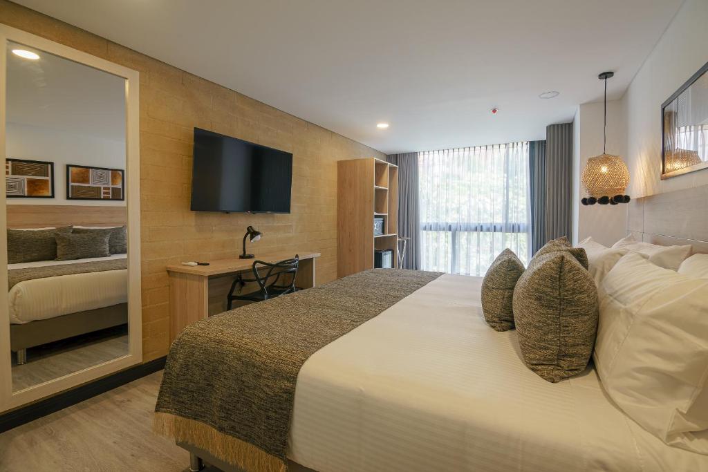 Tempat tidur dalam kamar di First Class Hotel