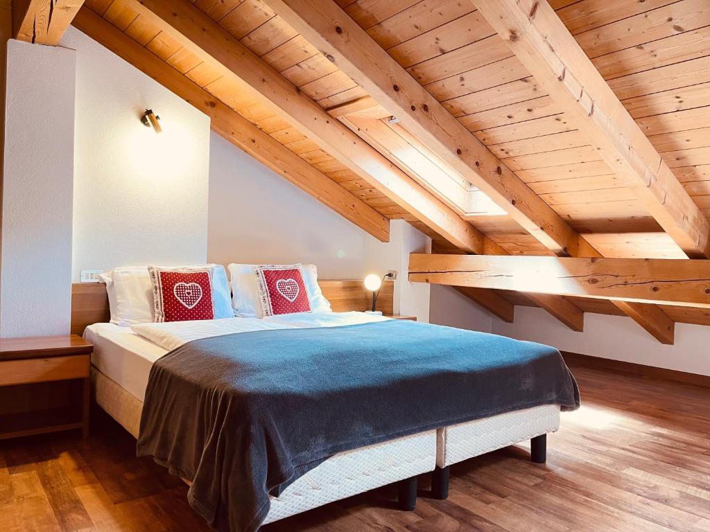 Una cama o camas en una habitación de Elga Residence - Relax in Alta Valtellina - Bormio