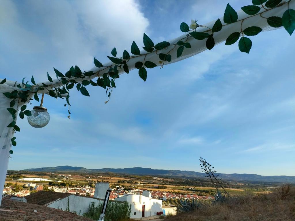 a garland with a view of a city at Casa da Muralha in Estremoz