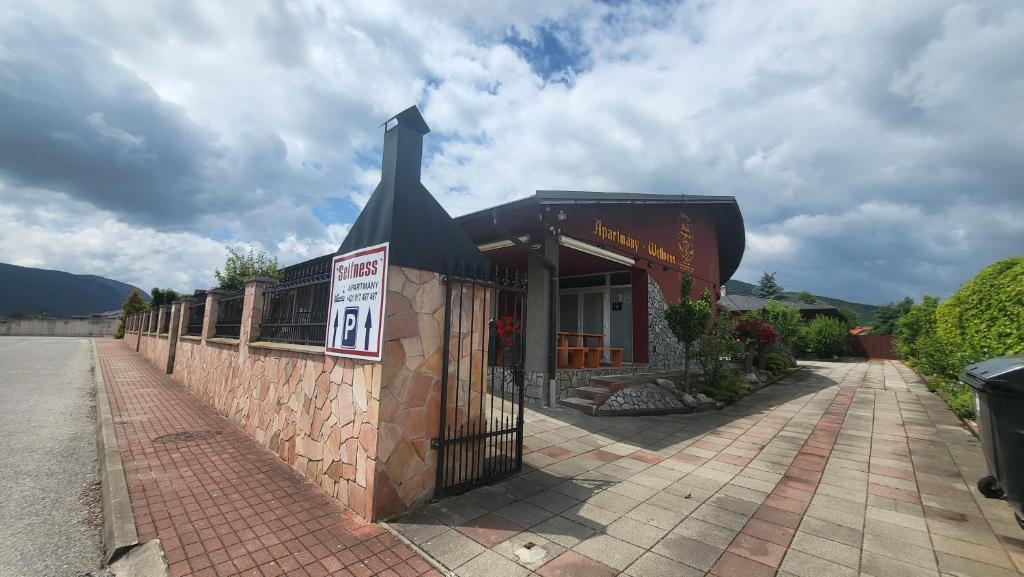 a building with a sign on the side of it at Selfness Rožňava in Rožňava