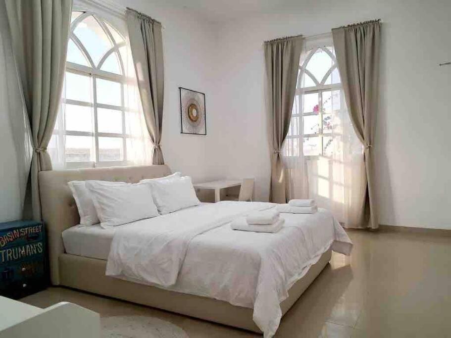 Tempat tidur dalam kamar di Villa 9 Palms Beach