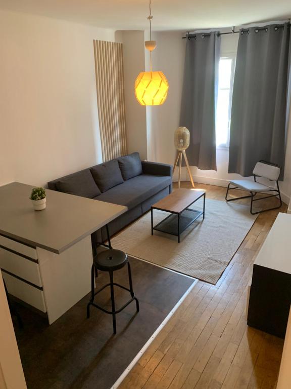 Uma área de estar em Appartement T3 Lyon, part Dieu