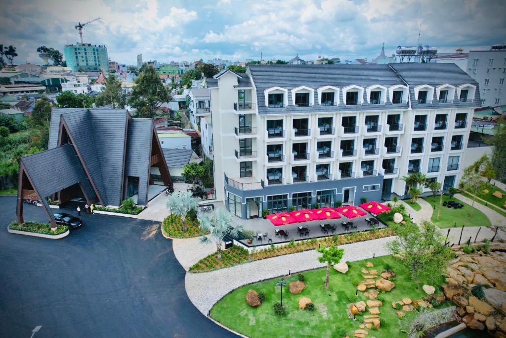 an aerial view of a hotel building with a courtyard at Sunflower Hotel & Resort in Bao Loc