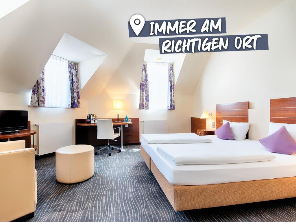 เตียงในห้องที่ ACHAT Hotel Wiesbaden City