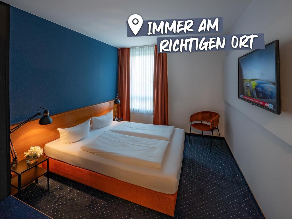 Llit o llits en una habitació de ACHAT Hotel Dresden Altstadt