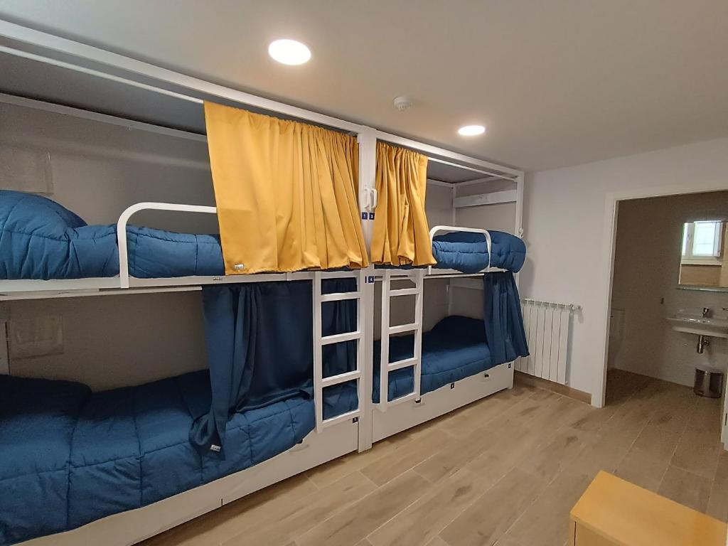 Postel nebo postele na pokoji v ubytování Albergue SP 55 by Bossh! Hotels