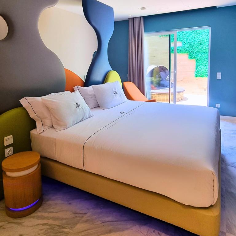 Tempat tidur dalam kamar di Hotel Avenue - Lovely hotel