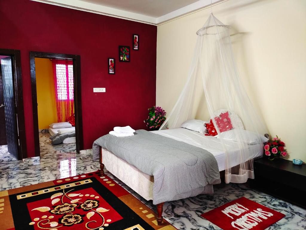 Katil atau katil-katil dalam bilik di Mannat Inn Homestay (Mysore)