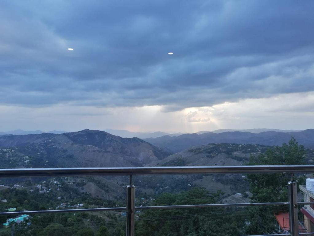 a view of the mountains from a balcony at Navid's Holiday Resort and Hotel, Murree in Ghora Gali