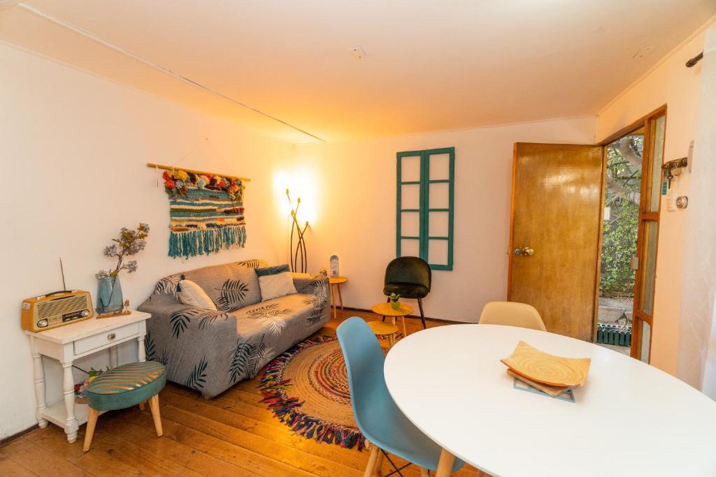 a living room with a table and a couch at Casa Doris in Vicuña