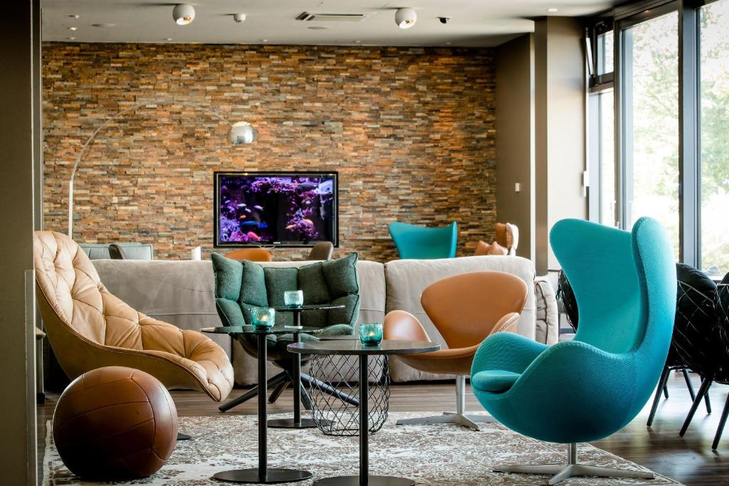 Зона вітальні в Motel One München-Garching