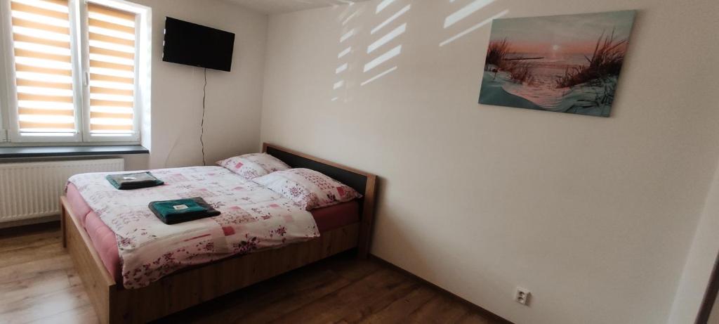 Ліжко або ліжка в номері Apartmán Kristýna