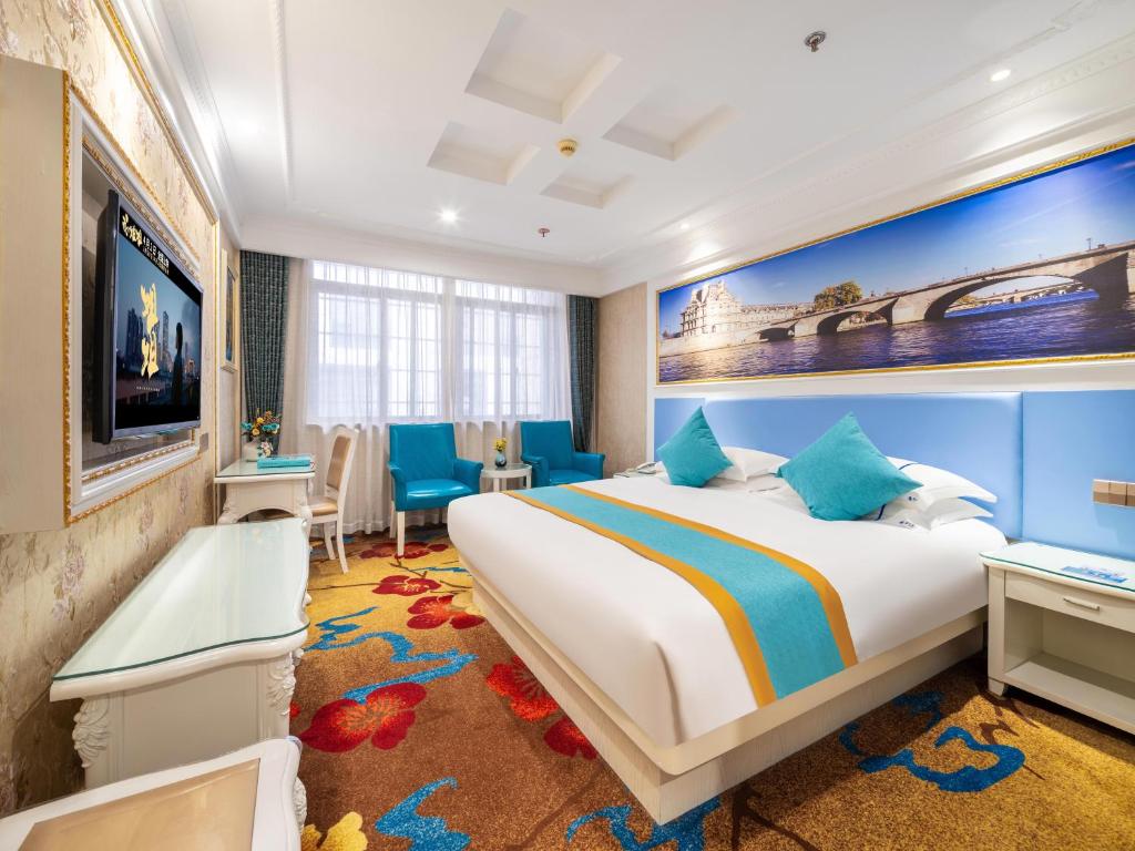 Yiwu Defeng Hotel में एक कमरे में एक या कई बेड