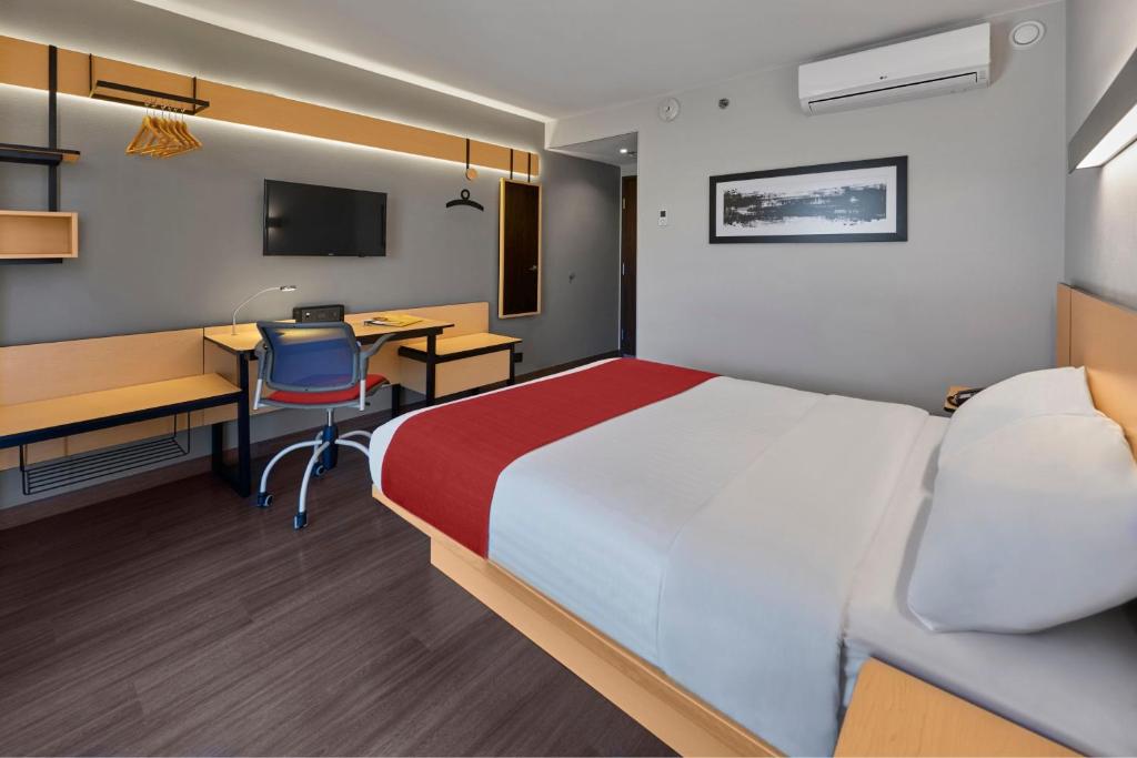 City Express by Marriott Tepic में एक कमरे में एक या कई बेड