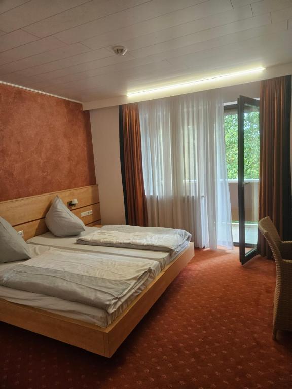 Postel nebo postele na pokoji v ubytování Terra Ventura Hotel