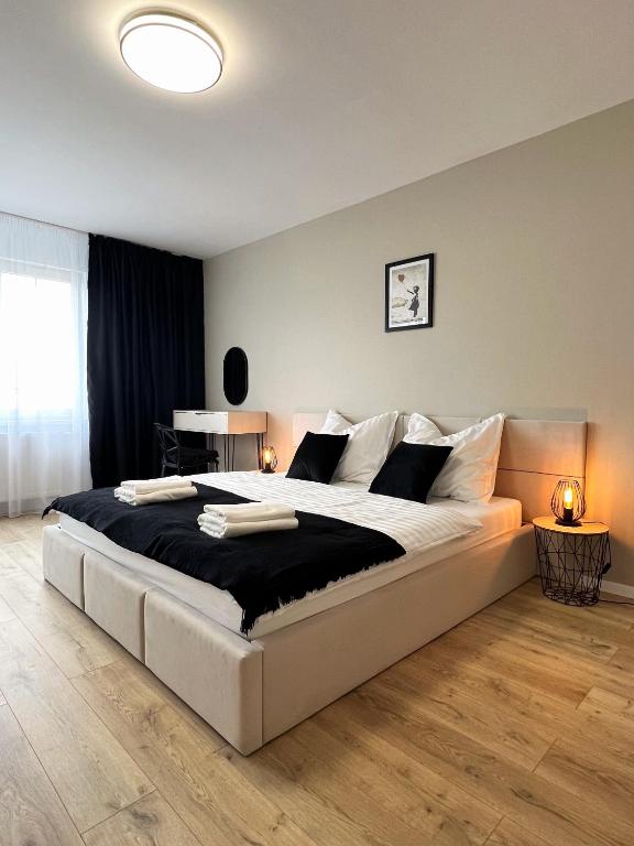 Posteľ alebo postele v izbe v ubytovaní Cozy Stay Apartment