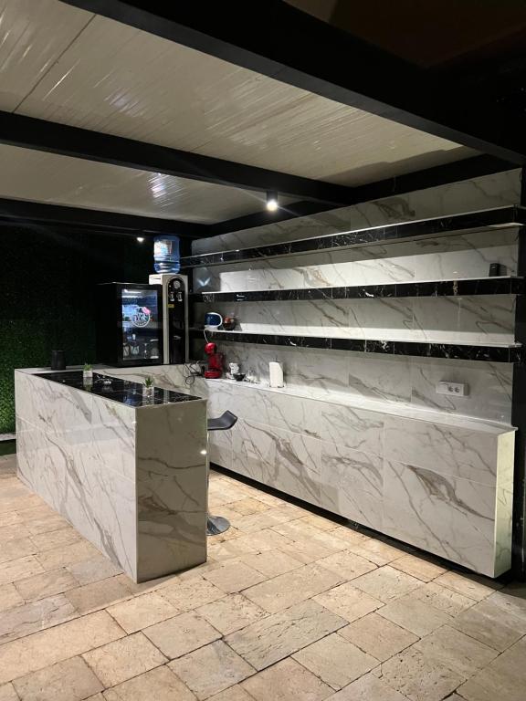 a lobby with a marble counter and shelves at Spa Lux Apatin in Apatin