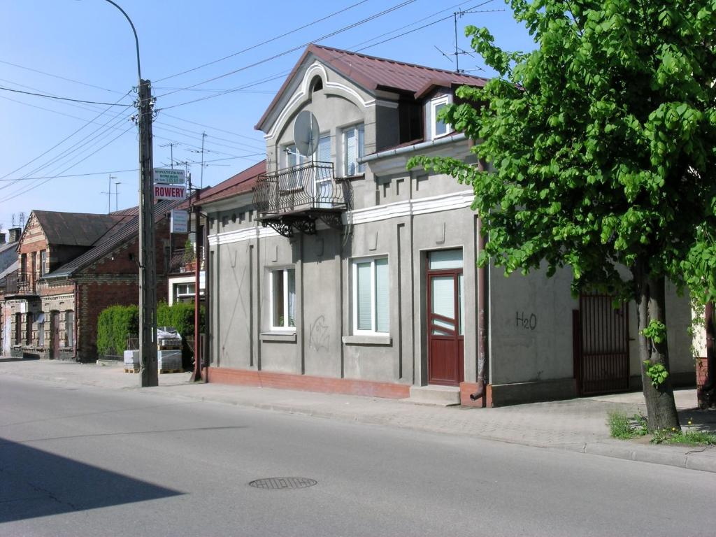 a building on the side of a street at Pokoje Centrum U Ani in Augustów