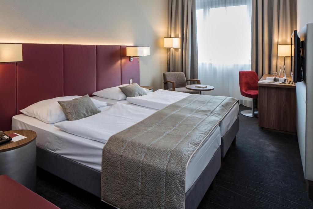 Cama ou camas em um quarto em Austria Trend Hotel Europa Salzburg