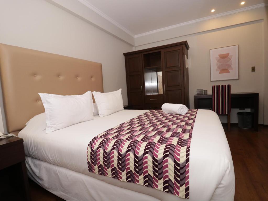 Ένα ή περισσότερα κρεβάτια σε δωμάτιο στο Domani Hotel Boutique