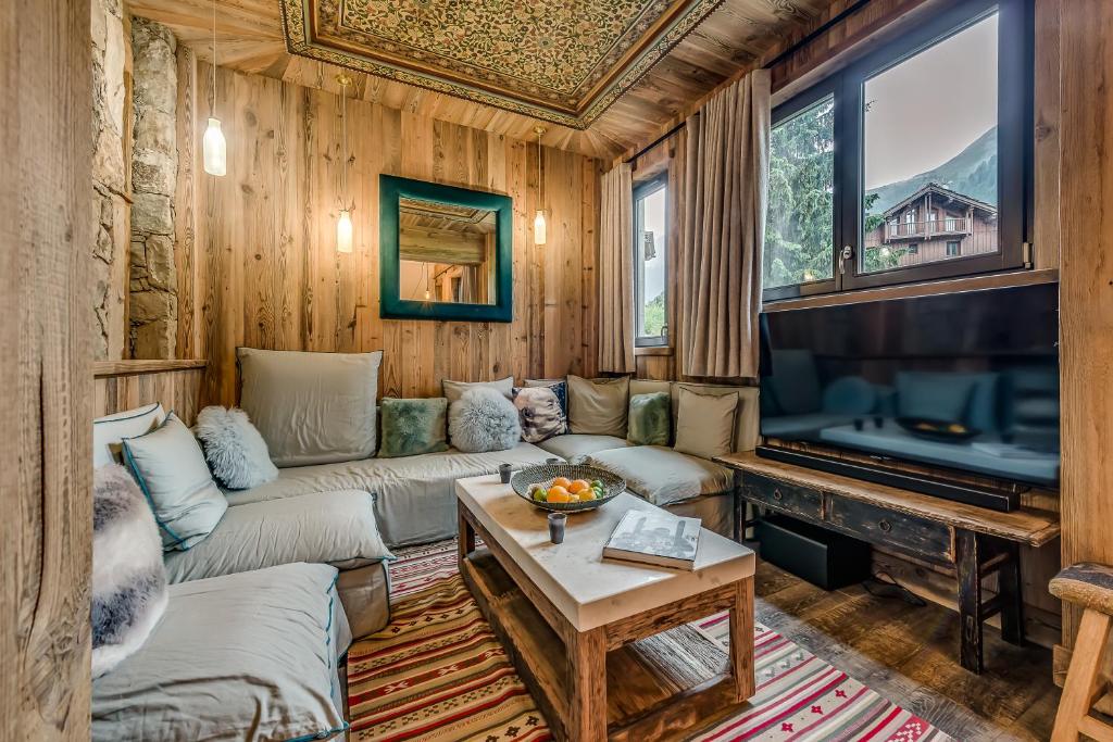 TV i/ili multimedijalni sistem u objektu Appartement FORNET à l'Hôtel LE VAL D'ISERE