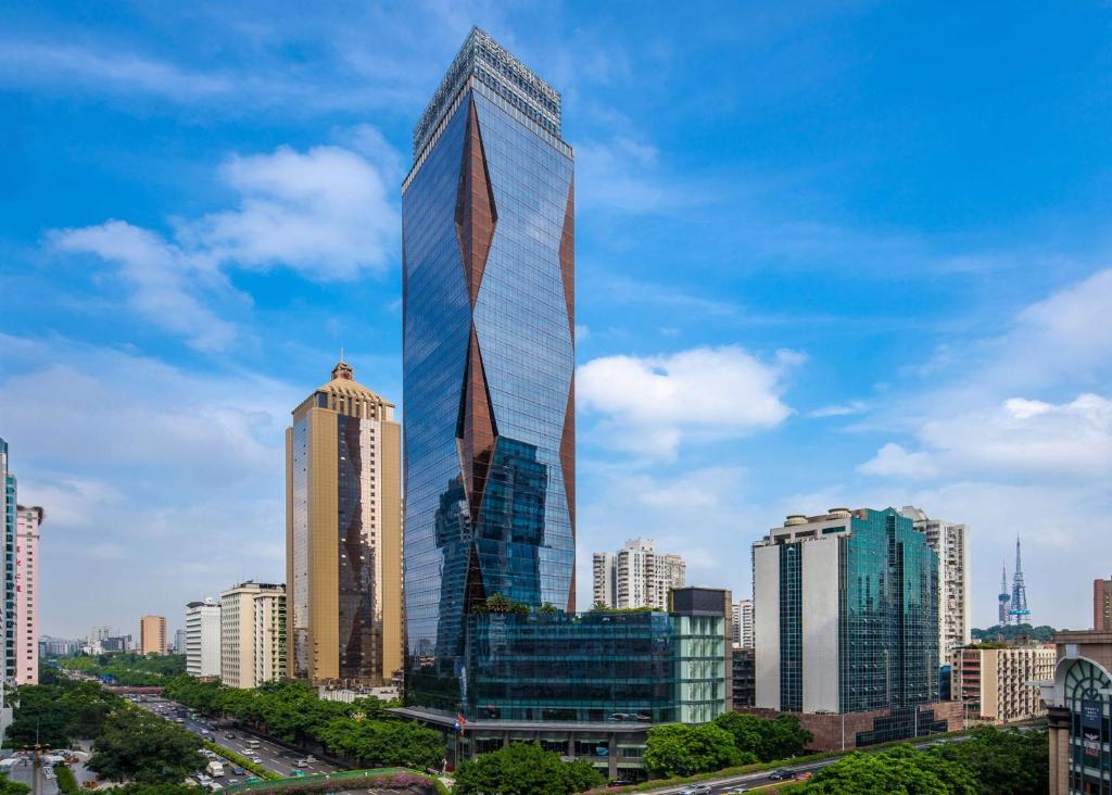 a rendering of a tall skyscraper in a city at DoubleTree by Hilton Guangzhou-Free Shuttle Bus to Canton Fair Complex & Overseas Buyer Registration Services during Canton Fair Period in Guangzhou