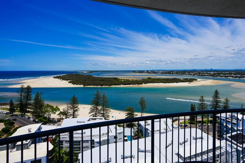 a view of a beach and the ocean from a balcony at Centrepoint Apartments Caloundra in Caloundra