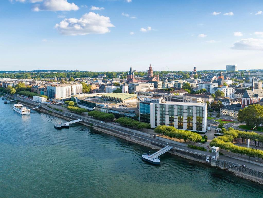 an aerial view of a city with a river at Hilton Mainz in Mainz